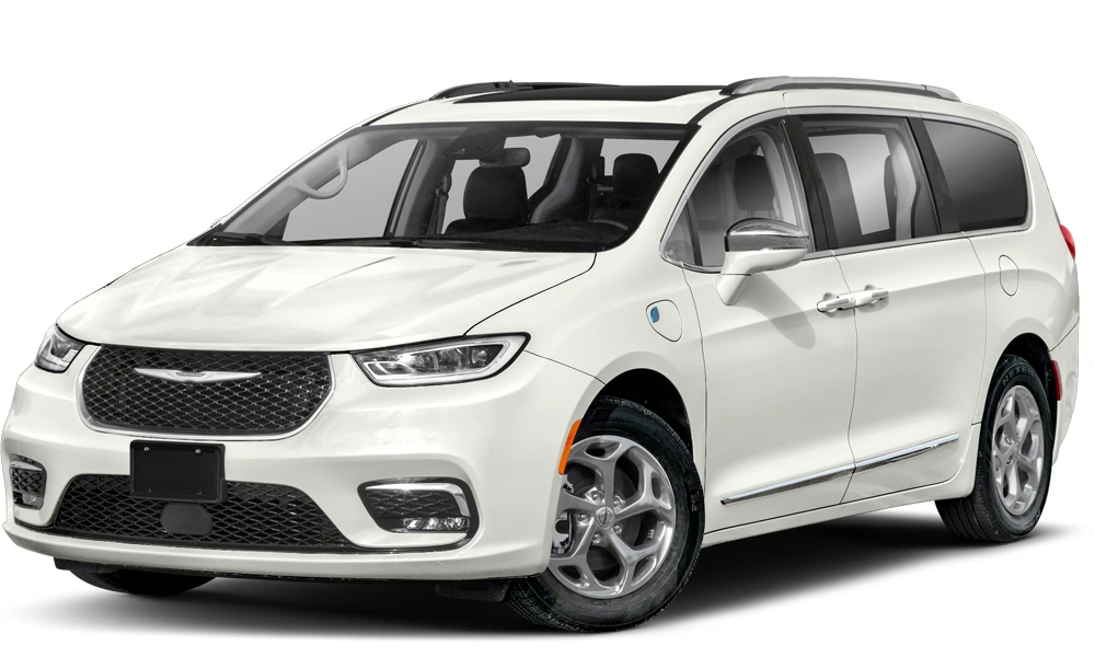 Chrysler Pacifica Plug-in Hybrid parked near a home, with the charging cable connected, emphasizing its family-friendly minivan design and eco-friendly plug-in feature.