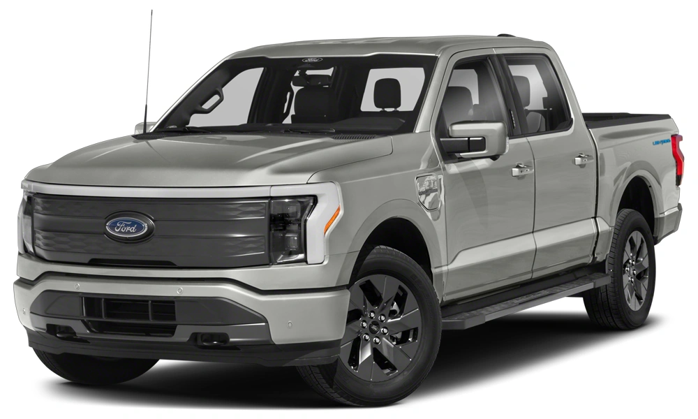 Front three-quarter view of a silver Ford F-150 Lightning, an all-electric full-size pickup truck, featuring a bold closed-off grille, LED headlights, and four-door crew cab configuration.