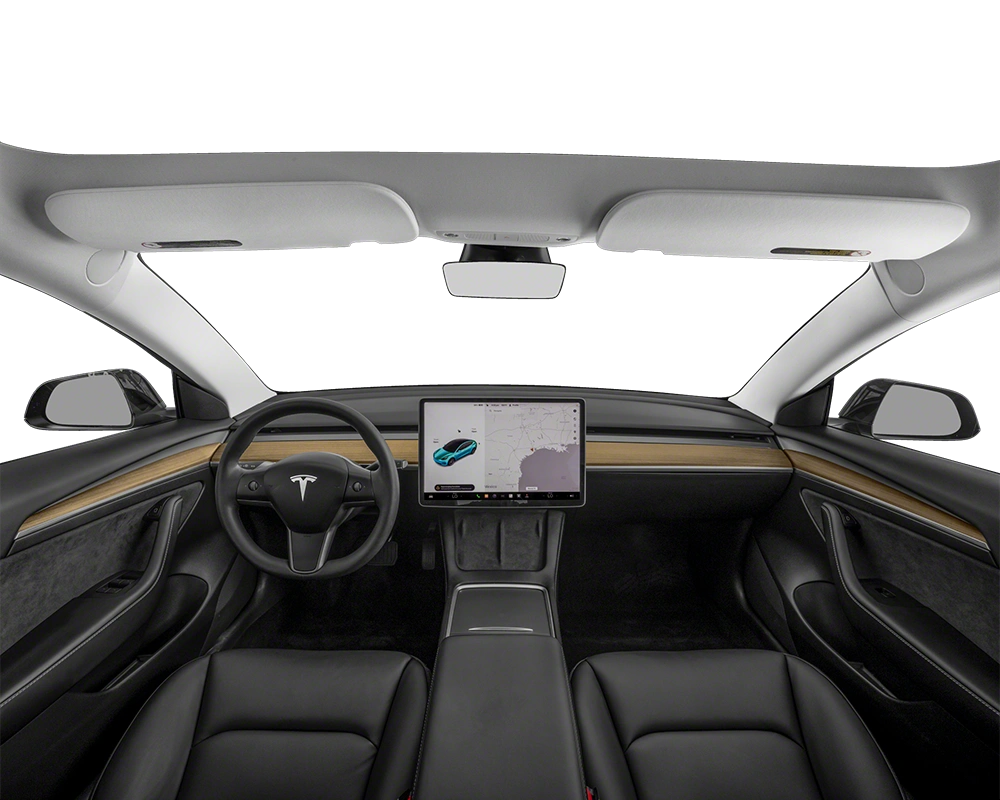 Interior view of the 2023 Tesla Model 3 showcasing a minimalist dashboard with a large central touchscreen, black leather seats, wood trim, and a panoramic glass roof.