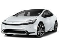 Front-side view of a white 2025 Toyota Prius, showcasing its sleek and aerodynamic exterior design with sharp LED headlights and stylish alloy wheels.