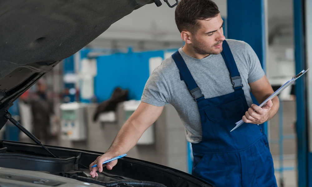 person inspecting the car